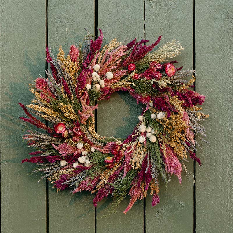dried floral wreath on door