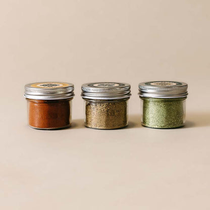 three small jars of seasoning blends